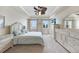 Bright bedroom with tray ceilings, neutral color scheme, and plenty of natural light at 5114 Melbourne St # A202, Punta Gorda, FL 33980