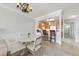 Charming dining area with white table, chairs, and open view to the kitchen at 5114 Melbourne St # A202, Punta Gorda, FL 33980