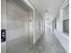 Well-lit hallway with elevator access at 5114 Melbourne St # A202, Punta Gorda, FL 33980