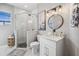 Bright bathroom featuring a glass shower, single vanity, and soft, modern accents at 529 La Caruna Ct, Punta Gorda, FL 33950