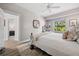 Bedroom with a ceiling fan, neutral walls, wood floors, and a comfortable bed at 529 La Caruna Ct, Punta Gorda, FL 33950
