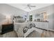 Cozy bedroom with a ceiling fan, neutral walls, and wood flooring at 529 La Caruna Ct, Punta Gorda, FL 33950