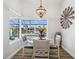 Cozy breakfast nook with canal view, a round table, and a decorative windmill wall hanging at 529 La Caruna Ct, Punta Gorda, FL 33950