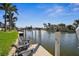 Private dock with comfortable seating and stunning waterfront views; perfect for relaxing at 529 La Caruna Ct, Punta Gorda, FL 33950