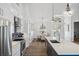 Spacious kitchen and breakfast nook with island, stainless steel appliances, and views to the dining room at 529 La Caruna Ct, Punta Gorda, FL 33950