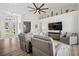 Bright living room with high ceilings, a ceiling fan, and lots of seating with views of the front entry at 529 La Caruna Ct, Punta Gorda, FL 33950