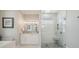 Bright main bathroom featuring a glass shower and a separate tub at 529 La Caruna Ct, Punta Gorda, FL 33950