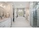 Elegant main bathroom with a large soaking tub, walk-in shower, and double vanity at 529 La Caruna Ct, Punta Gorda, FL 33950