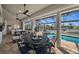Charming outdoor dining area overlooking a pool and waterfront; perfect for entertaining guests at 529 La Caruna Ct, Punta Gorda, FL 33950