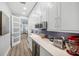 Pantry with quartz countertops, wine fridge, and stainless steel appliances at 529 La Caruna Ct, Punta Gorda, FL 33950