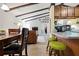 An expansive view of the open-concept layout, seamlessly connecting the living space and kitchen area at 5390 Brassy Loop, North Port, FL 34287