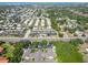 An aerial view of a condominium complex features a sparkling swimming pool and parking near main road at 5416 Swift Rd # 27, Sarasota, FL 34231