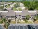 Aerial shot of condos with screened patios, landscaping, and parking, in a well-maintained community at 5416 Swift Rd # 27, Sarasota, FL 34231