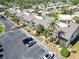 High-angle view of condo buildings and parking, surrounded by manicured landscaping at 5416 Swift Rd # 27, Sarasota, FL 34231