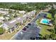 An aerial view of condo complex shows parking, pool and screen patios at 5416 Swift Rd # 27, Sarasota, FL 34231