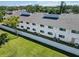 Back of a two story condo building with well maintained yard and AC units at 5416 Swift Rd # 27, Sarasota, FL 34231