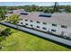 Back of a two story condo building with well maintained yard and AC units at 5416 Swift Rd # 27, Sarasota, FL 34231