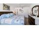 Bright bedroom with nautical bedding, wood floors, ceiling fan, and closet at 5416 Swift Rd # 27, Sarasota, FL 34231