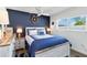 Bedroom with nautical decor, ceiling fan, window, lamps and whitewashed furniture at 5416 Swift Rd # 27, Sarasota, FL 34231
