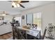 Open dining room with stylish table and chairs that flows into the living room at 5416 Swift Rd # 27, Sarasota, FL 34231