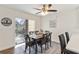 Bright dining room with a sliding glass door, stylish table and chairs, and plenty of natural light at 5416 Swift Rd # 27, Sarasota, FL 34231
