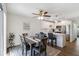 Open dining room with stylish table and chairs, with a modern kitchen in the background at 5416 Swift Rd # 27, Sarasota, FL 34231
