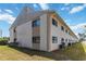 Exterior view showcasing the building's architecture and well-maintained landscaping around the property at 5416 Swift Rd # 27, Sarasota, FL 34231