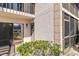 Condo unit exterior featuring a wreath on the door, a window and landscaping at 5416 Swift Rd # 27, Sarasota, FL 34231