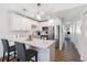 Bright, modern kitchen features white cabinets, stainless steel appliances and a breakfast bar at 5416 Swift Rd # 27, Sarasota, FL 34231