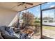 Cozy lanai featuring comfortable seating, ceiling fan, privacy screens and views of the exterior at 5416 Swift Rd # 27, Sarasota, FL 34231