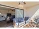 Relaxing screened lanai with comfortable seating, ceiling fan, and view to the interior at 5416 Swift Rd # 27, Sarasota, FL 34231
