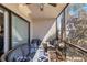 Screened porch with wicker furniture, cushions, and outdoor view at 5416 Swift Rd # 27, Sarasota, FL 34231