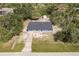 An aerial view of the home in a private and lush wooded community at 6329 David Blvd, Port Charlotte, FL 33981