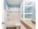 Well-lit bathroom featuring a shower-tub combo, granite countertop, and decorative mosaic tile at 6329 David Blvd, Port Charlotte, FL 33981