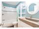 Well-lit bathroom featuring a shower-tub combo, granite countertop, and decorative mosaic tile at 6329 David Blvd, Port Charlotte, FL 33981
