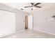 Bedroom with neutral walls, ceiling fan, and closet, offering ample space at 6329 David Blvd, Port Charlotte, FL 33981