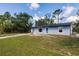 Welcoming single-story home with a green lawn and a cozy, peaceful setting at 6329 David Blvd, Port Charlotte, FL 33981