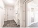 Hallway with built-in pantry shelving and storage, and access to the sun room at 6329 David Blvd, Port Charlotte, FL 33981