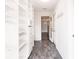 Hallway featuring built-in pantry with drawers and shelving next to dining room at 6329 David Blvd, Port Charlotte, FL 33981