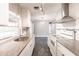 Updated kitchen with breakfast nook, modern light fixtures, and granite counters at 6329 David Blvd, Port Charlotte, FL 33981