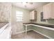 Laundry room with tile floor, cabinets, counter space, and a window at 6329 David Blvd, Port Charlotte, FL 33981