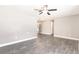 Open living room showcasing modern flooring, neutral walls, and a ceiling fan at 6329 David Blvd, Port Charlotte, FL 33981