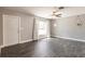 Inviting living room featuring sleek flooring, large windows with curtains, and neutral decor at 6329 David Blvd, Port Charlotte, FL 33981