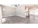 Bright living room featuring stylish flooring, ample natural light, and a ceiling fan at 6329 David Blvd, Port Charlotte, FL 33981