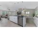 Bright open concept eat-in kitchen featuring granite countertops, stainless appliances, and breakfast bar seating at 6346 Lachine Ave, North Port, FL 34291
