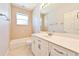 Bright bathroom featuring a tub, neutral tile, and a vanity with ample counter space at 8315 Raoul Ave, North Port, FL 34291