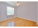 A sunlit bedroom showcasing light gray walls and gleaming hardwood floors at 8315 Raoul Ave, North Port, FL 34291