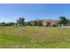 A charming single-story house featuring arched windows and a well-manicured lawn at 8315 Raoul Ave, North Port, FL 34291
