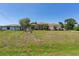Single-story house with arched windows and green lawn at 8315 Raoul Ave, North Port, FL 34291