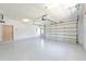 Spacious two-car garage features freshly epoxied floors, ample lighting, and an automatic door opener at 8315 Raoul Ave, North Port, FL 34291